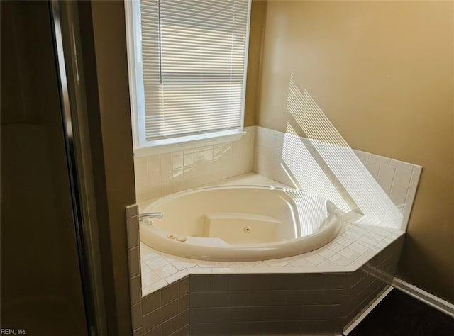 bathroom with tiled tub