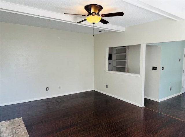 spare room with beamed ceiling, ceiling fan, and dark hardwood / wood-style flooring