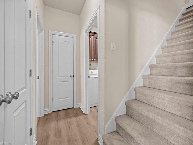 stairs with wood-type flooring