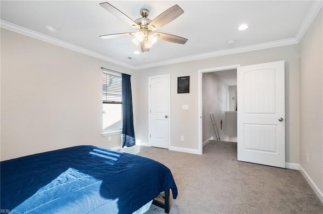 bedroom featuring crown molding, light colored carpet, and ceiling fan