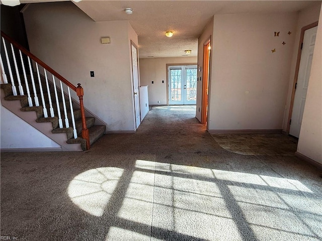 hall with carpet flooring and french doors