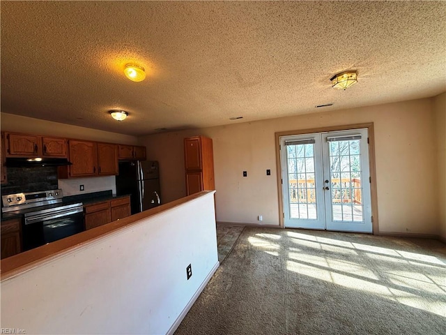 kitchen featuring french doors, black fridge, light carpet, and stainless steel electric range