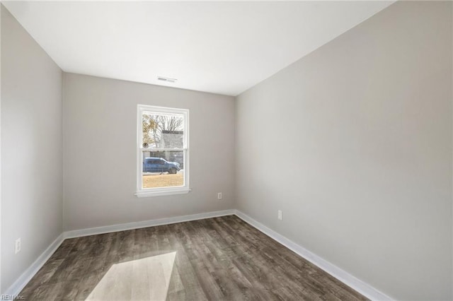 unfurnished room with hardwood / wood-style floors