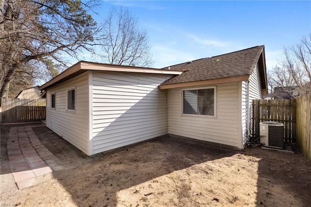 view of side of home featuring a patio and cooling unit