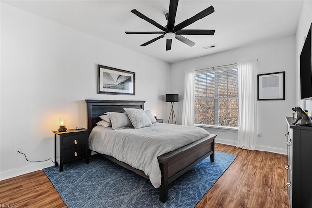 bedroom with hardwood / wood-style flooring and ceiling fan