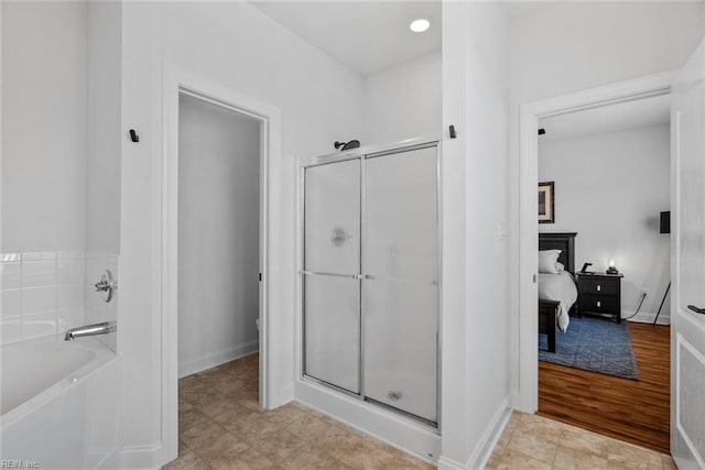 bathroom featuring plus walk in shower