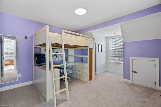 bedroom featuring light carpet