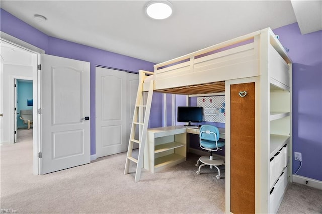 carpeted bedroom with a closet