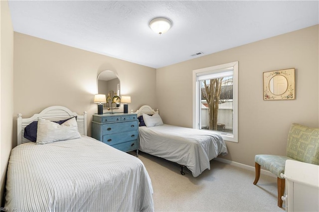 bedroom featuring light carpet