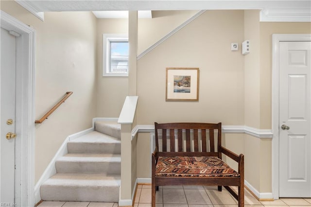 staircase featuring tile patterned flooring