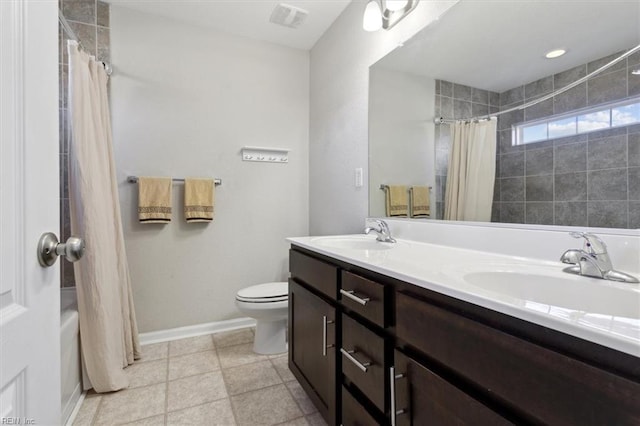 full bathroom with shower / tub combo with curtain, vanity, and toilet