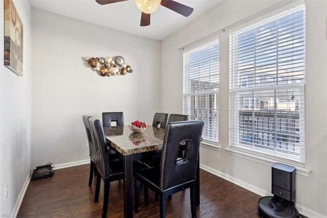 dining room featuring ceiling fan and dark hardwood / wood-style floors