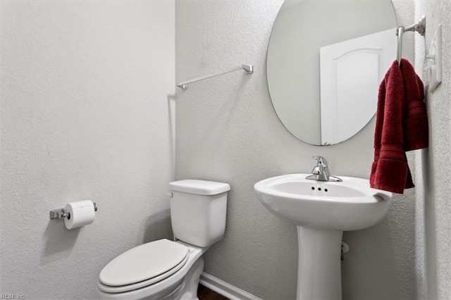 bathroom featuring toilet