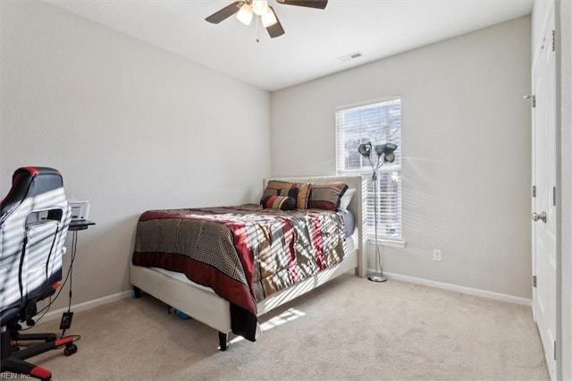 bedroom with light carpet and ceiling fan