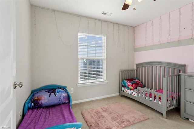 bedroom with light carpet and ceiling fan