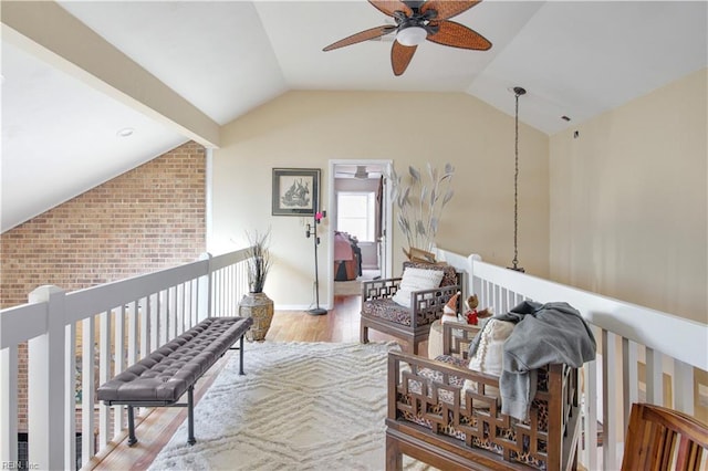 living area with lofted ceiling and light wood-type flooring