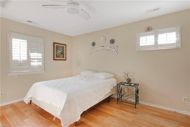 bedroom featuring ceiling fan and wood-type flooring