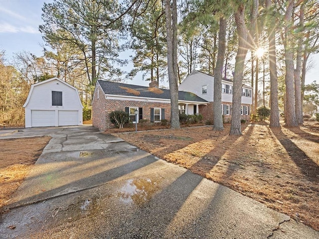 view of front facade with an outbuilding and a garage