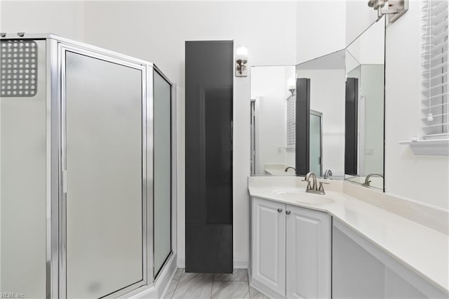 bathroom featuring vanity and an enclosed shower