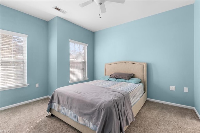 bedroom featuring light carpet and ceiling fan