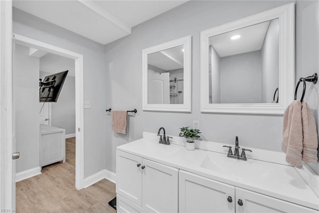 bathroom with vanity and hardwood / wood-style floors