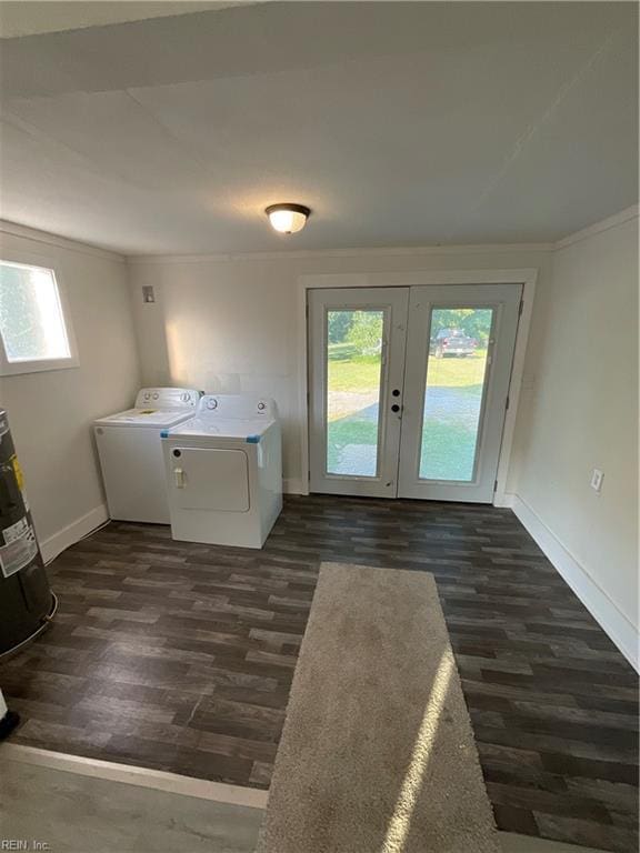 washroom with plenty of natural light, washer and dryer, and dark hardwood / wood-style flooring