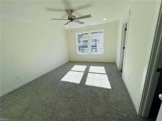 carpeted empty room featuring ceiling fan