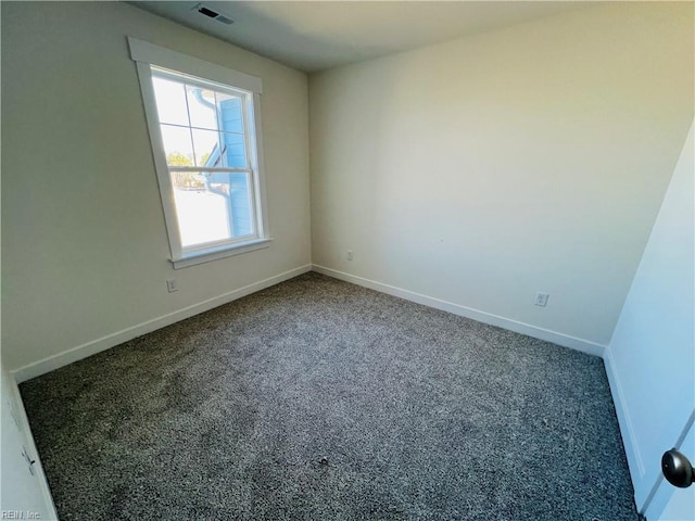 spare room featuring carpet floors