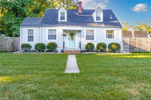 new england style home with a front lawn