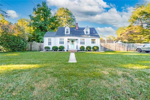 cape cod home featuring a front yard