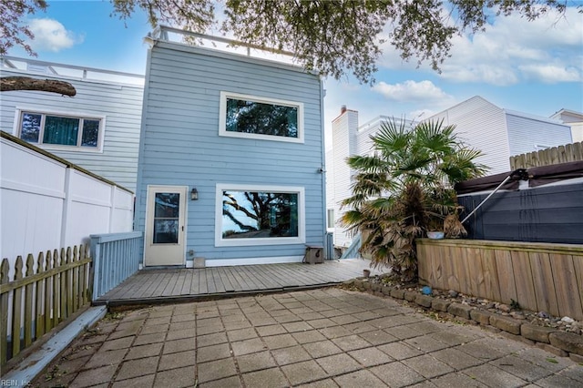 rear view of property featuring a patio area