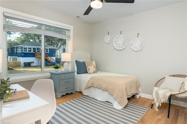 bedroom featuring light hardwood / wood-style flooring and ceiling fan