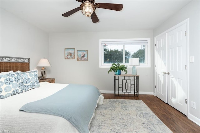 bedroom featuring dark wood-type flooring and ceiling fan