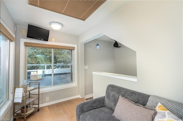 living area with light hardwood / wood-style flooring