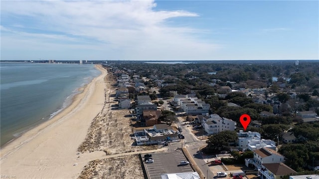 drone / aerial view featuring a water view and a beach view