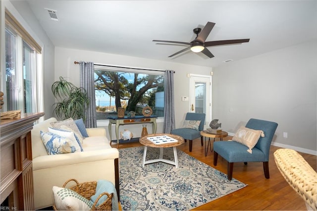 sitting room featuring hardwood / wood-style floors and ceiling fan