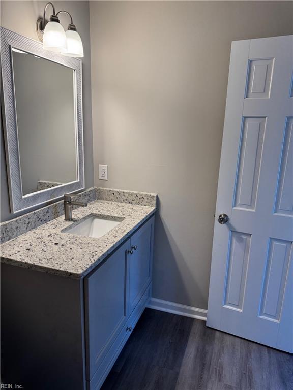 bathroom with vanity and hardwood / wood-style floors