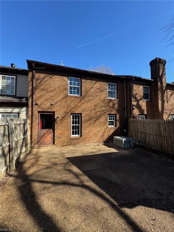 back of house featuring central AC and a patio area