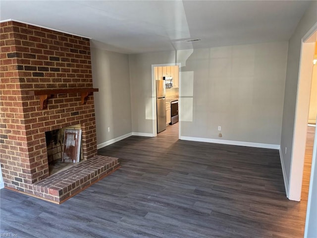 unfurnished living room with dark hardwood / wood-style floors and a fireplace