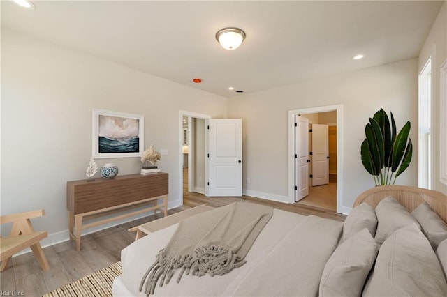 bedroom with light hardwood / wood-style flooring