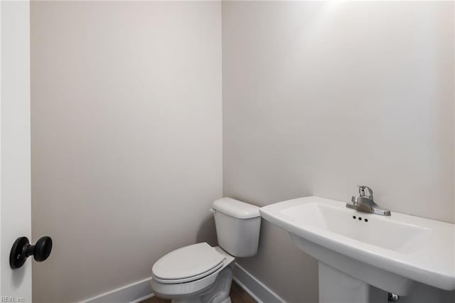 bathroom with sink and toilet