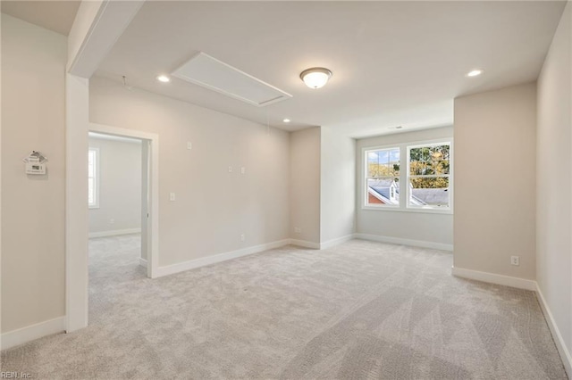 empty room featuring light carpet