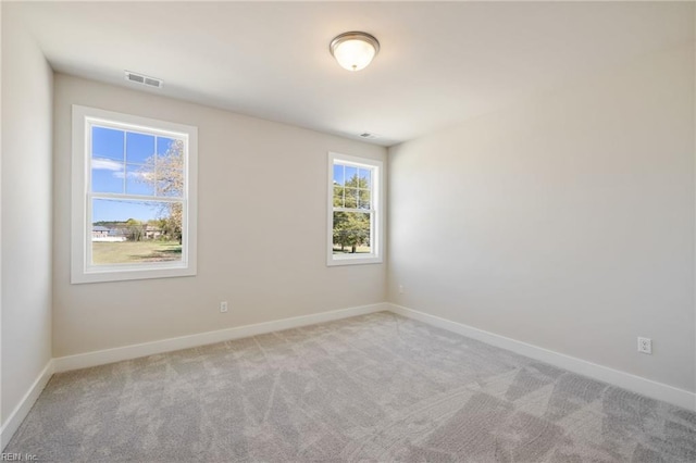 empty room featuring light carpet