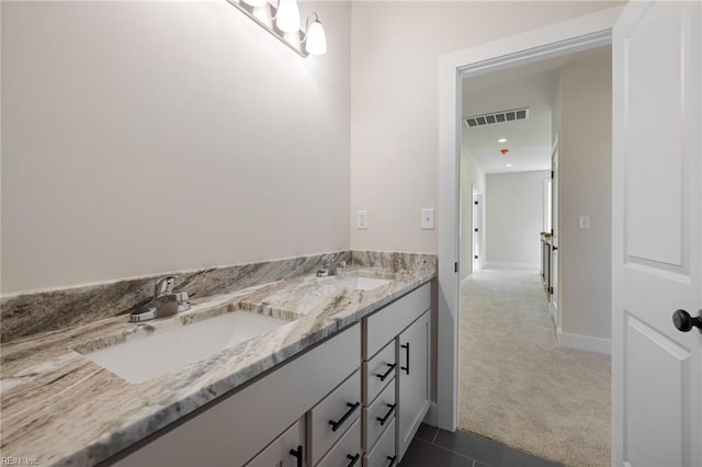 bathroom with vanity and tile patterned floors