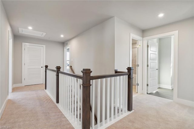 hallway with light carpet