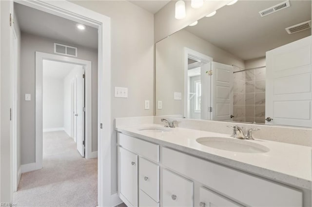 bathroom featuring vanity and a shower