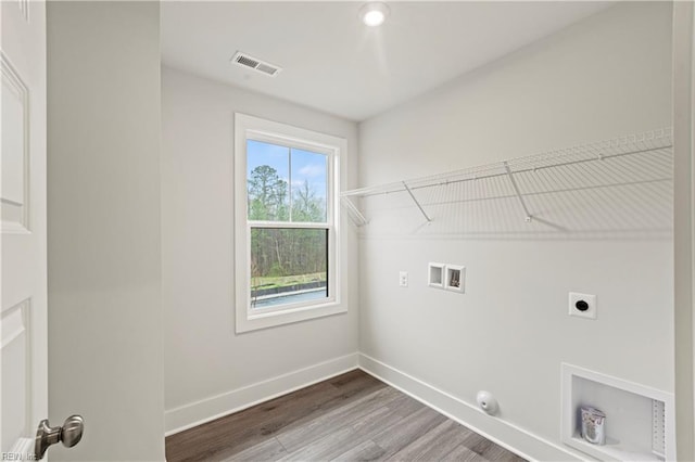 laundry area featuring washer hookup, hookup for a gas dryer, wood-type flooring, and electric dryer hookup