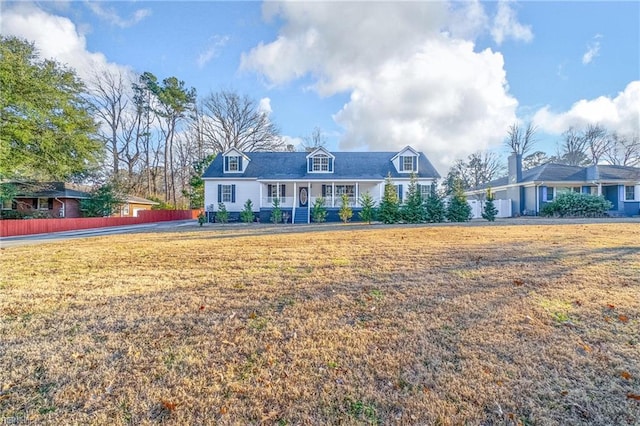 view of front of home featuring a front yard and covered porch