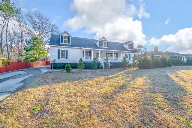 cape cod-style house with a porch and a front yard