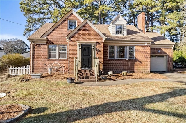 view of front of home featuring a garage and a front lawn